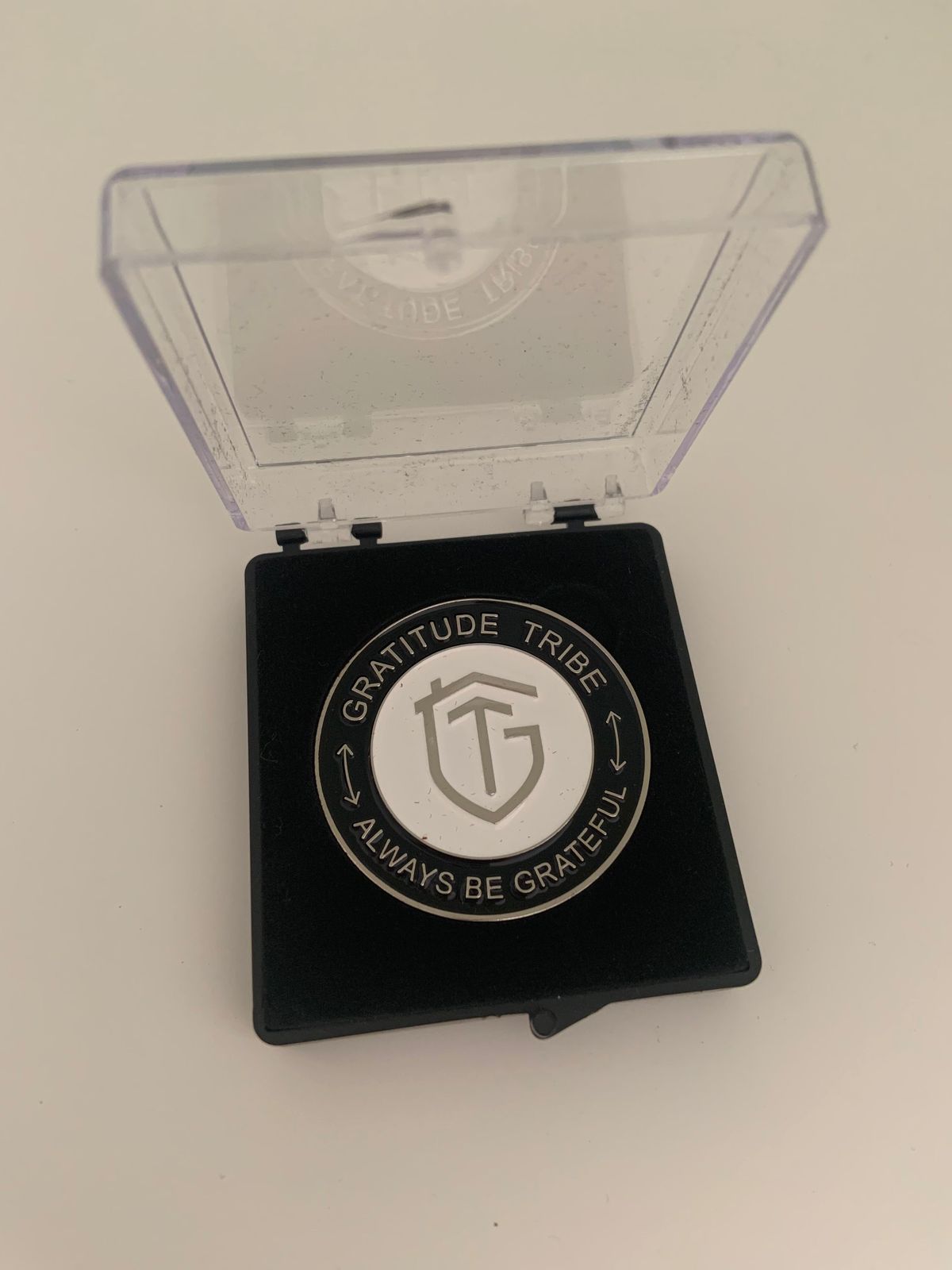 Inspirational commemorative coin, black, white, front.