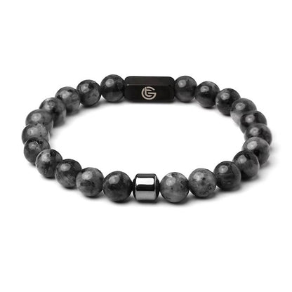 Black beaded bracelet with a black clasp on a white background, black, front.