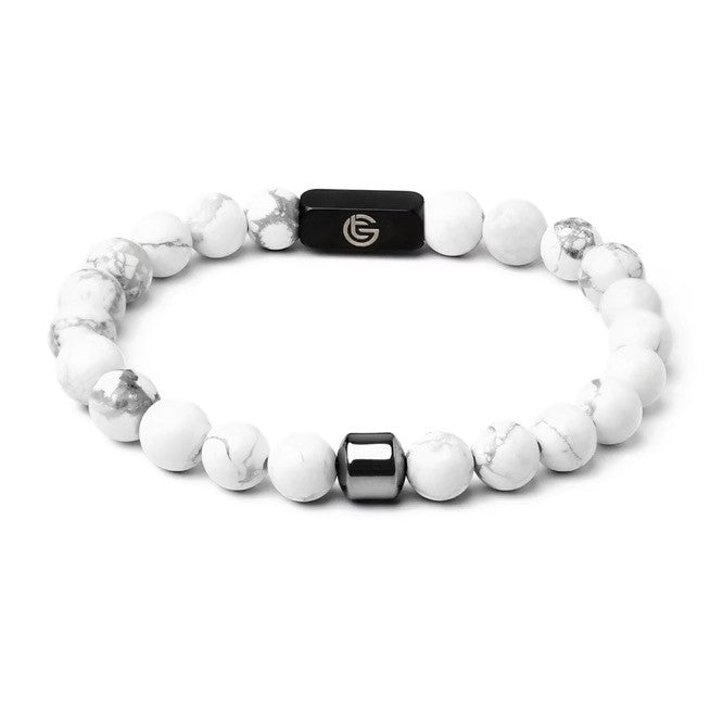 White beaded bracelet with black and silver accents on a white background, white, front.